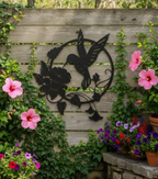 Hummingbird sign on wooden garden fence